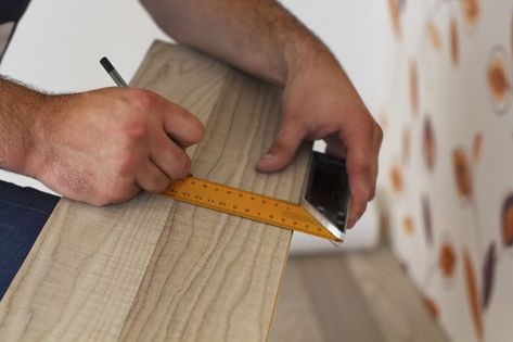 As it's almost impossible to purchase the exact amount of laminate flooring you need, you may find yourself with some leftover planks after installing it. Keep a few planks aside in case you ever need to repair your floor, but consider using the rest for craft projects. Vynal Flooring, Laminate Flooring Diy, Pallet Signs Diy, Sliding Curtains, Scrap Projects, Pergo Flooring, Light Hardwood Floors, Wood Laminate Flooring, Wide Plank Flooring