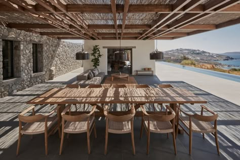 K Studio builds stone and timber holiday house on Mykanos Villa Mandra, Wooden Table And Chairs, Studio Build, Outdoor Dining Spaces, Wooden Pergola, Summer Living, Traditional Architecture, House Built, Hotels Design