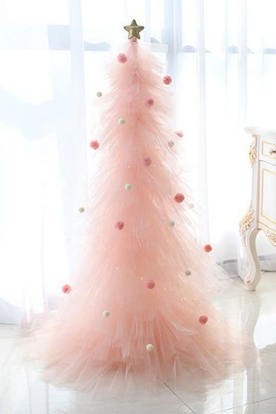 Where to Buy Pink Tulle Christmas Trees Pink Tabletop Christmas Tree, Pink Tulle Christmas Tree, How To Make Tulle Christmas Trees, Outdoor Pink Christmas Decor, Pink Tree Decorations Decorating Ideas, Christmas Tree With Tulle, Pink Christmas Crafts Diy, Black And Pink Christmas Tree Ideas, Tulle Tree