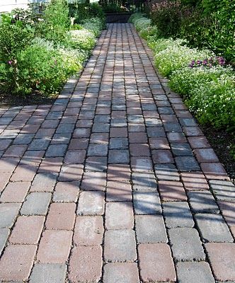 Brick pathway and tidy garden beds. Winter Grass Seed, Patio Driveway Ideas, House Of Philia, Italy Moda, Garden Pathways, Brick Pathway, Brick Path, Solar Pathway Lights, Lawn Sprinklers