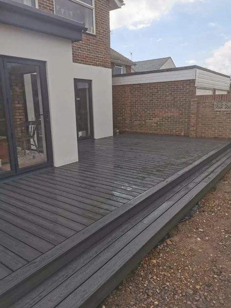 Garden Decking And Paving Ideas, Large Decking Area Ideas, Composite Decking Designs Patio, Black Garden Decking, Charcoal Composite Decking, Outside Decking Ideas, Dark Grey Decking Ideas, Back Garden Decking Ideas, Garden Design Decking