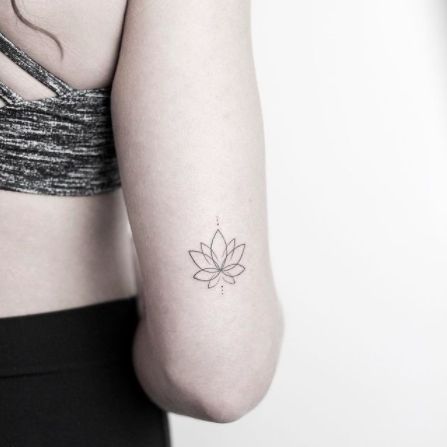 Back Of The Arm Lotus Flower Tattoo. A tricep lotus design with overlapping lines and dots. Click through for 40 lotus flower tattoo ideas. #lotusflowertattoos #tattooideas #flowertattoos IG: @rachainsworth Small Lotus Tattoo, Cat Tattoos, Tiny Tattoo, Instagram Tattoo, Lotus Tattoo, Flower Tattoo Designs, Symbolic Tattoos, Simplistic Tattoos, Fine Line Tattoos