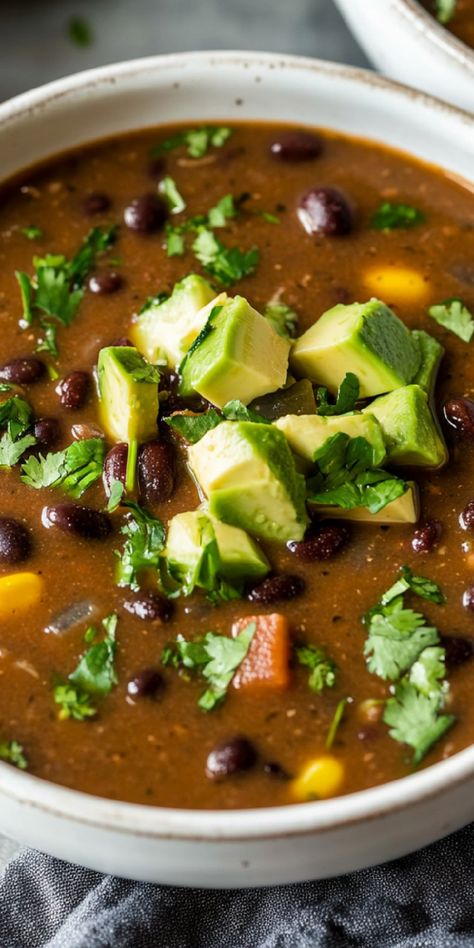 Warm up with a spicy Black Bean Soup! With jalapeño and cayenne, this soup delivers a flavorful kick perfect for chili lovers. Panera Black Bean Soup Recipe, Panera Black Bean Soup, Chicken Black Bean Soup, Spicy Black Bean Soup Recipe, Spicy Black Bean Soup, Mexican Bean Soup, Chicken Black Bean, Mexican Black Beans, Black Bean Soup Recipe