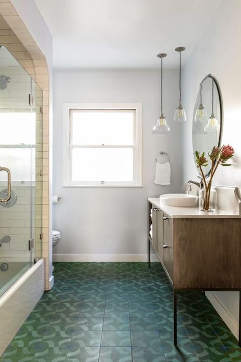 I love when my interior design clients are down for bold designs! When designing this modern bathroom, I chose a dark brown console table and added a white stone countertop, and I chose a dark green patterned concrete tile for the floor. See the blog for the full bathroom transformation! Bathroom With Green Floor, Bathroom Green Floor, Green Floor Tile Bathroom Ideas, Dark Green Bathroom Floor, Teal Floor Tile Bathroom, Bathroom Green Tile Floor, Small Bathroom Dark Tile, Green Floor Bathroom, Dark Green Tile Bathroom Floor