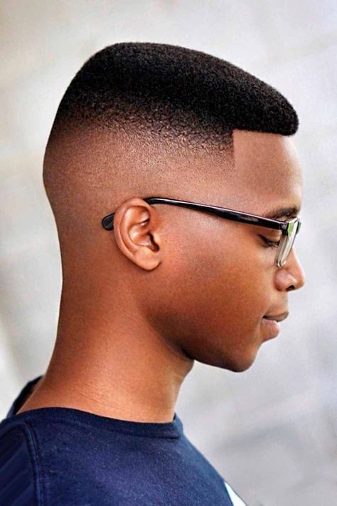 Check out the coolest black boys haircuts we have put together in our gallery. Here you will find a short curly hair mohawk with a fade, a low taper with curls, waves with a side part and many other trendy hairstyles for kids. #menshaircuts #menshairstyles #blackboyshaircuts #boyshaircuts #haircutsforblackboys Tapered Mohawk, Black Boys Haircuts Fade, High Top Fade Haircut, Black Man Haircut Fade, Top Fade Haircut, Faded Haircut, Types Of Fade Haircut, Black Hair Afro, Black Boys Haircuts