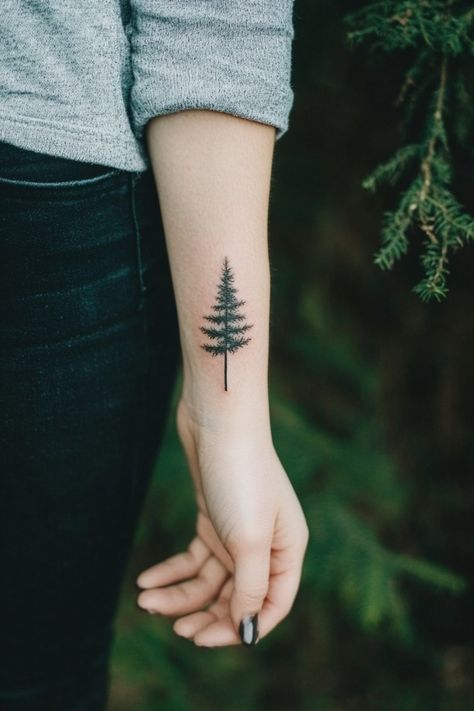 Forearm with a detailed tattoo of a pine tree. Fine Line Pine Tree Tattoo, Dainty Wrist Tattoos, Tiny Tree Tattoo, Small Tattoo Placement Ideas, Evergreen Tattoo, Washington Tattoo, Small Nature Tattoo, Minimalist Symbols, Small Compass Tattoo