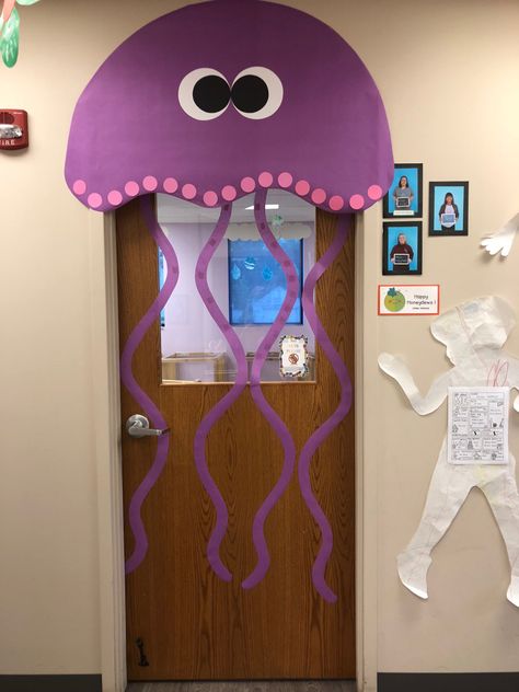 Jellyfish classroom door #preschool #oceandoor Under The Sea Preschool Decorations, Diy Ocean Classroom Decor, Diy Under The Sea Decorations Classroom, Ocean Door Decorations, Jellyfish Bulletin Board, Jellyfish Classroom Theme, Beach Theme Classroom Door, Sea Door Decorations Classroom, Jellyfish Classroom Door Decoration