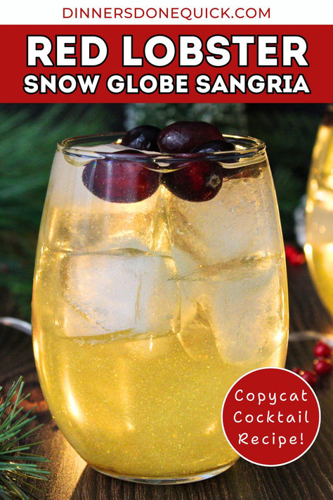 Love Red Lobster's Snow Globe Sangria? Recreate it at home with this easy copycat recipe! Sweet Barefoot Moscato, floral elderflower liqueur, white cranberry juice, and a touch of gold edible shimmer make this festive cocktail a showstopper. Perfect for Christmas parties, holiday gatherings, or cozy nights in. Celebrate the season with this sparkling sangria—cheers! Save this holiday drink recipe now. ✨ #SnowGlobeSangria #HolidayCocktails #CopycatRecipes #ChristmasCocktails #FestiveDrinks Snow Globe Sangria Red Lobster, Red Lobster Snowglobe Sangria, Snow Globe Sangria, Red Lobster Sangria Recipe, Snowglobe Sangria, Holiday Sangria Christmas, Snow Globe Drink, Sweet Sangria Recipes, Christmas Sangria Red