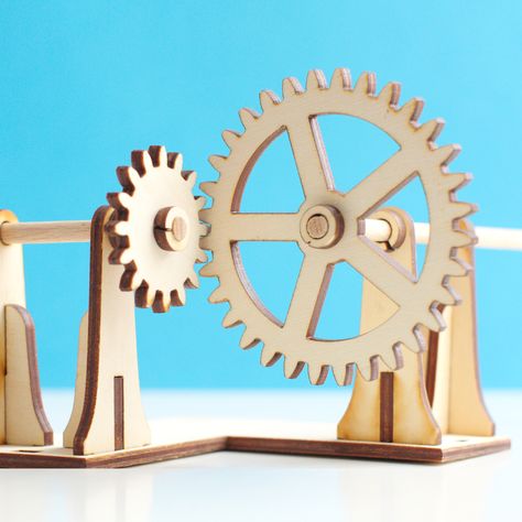 Laser cut right angle gear mechanism. The axels are made from wooden dowels. Marble Machine, Gear Design, Mechanical Gears, Wooden Gears, Beer Fridge, Bevel Gear, Laser Ideas, Nuts Bolts, Kinetic Art