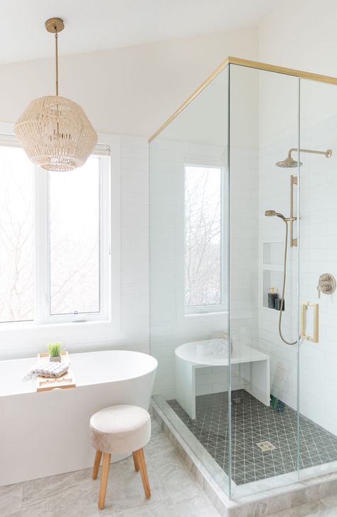 A standing glass shower with brass accents fills the bathroom with functional space while keeping it modern and bright. Wall To Wall Tile Bathroom, Cloe Tile Master Bath, Cloe Bathroom Tile, Tub Not Centered Under Window, Cloe Shower Tile, All Glass Shower Ideas, Cloe Tile Shower Bathroom, Cloe Tile Bathroom, Glass Shower Ideas