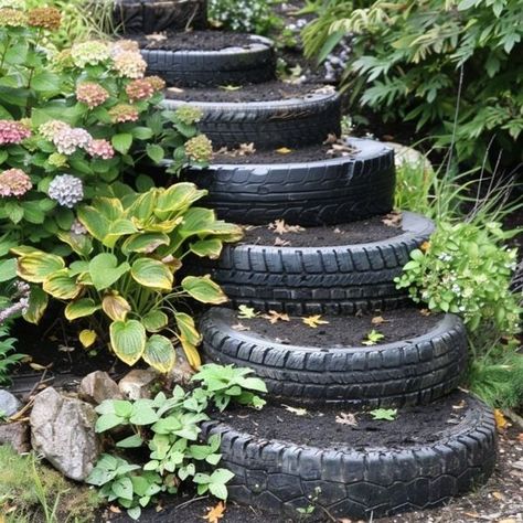 Plants In Tires Gardens, Hanging Tire Planters, Tyre Retaining Wall, Upcycle Old Tires, Reuse Tires Diy Projects, Old Tire Ideas, Old Tires Ideas Garden Decorations, Tire Diy Projects, Garden Tyre Ideas