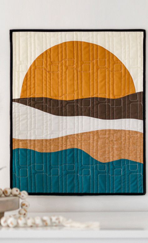 Save this How to Make Freestyle Sunset Wall Hanging! This project is perfect for all those sunset chasers out there. In this tutorial, follow along with Misty as she creates a wall hanging that shows off the most beautiful sunset. Sunset Quilts, Sunset Quilt Pattern, Wall Hanging Quilts, Triangle Quilt Tutorials, Cake Quilt, Layer Cake Quilts, Patriotic Fabric, Hanging Quilts, Quilts Decor