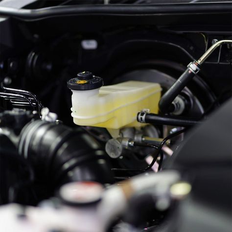 Signs that indicate you need a brake fluid change include a soft or spongy brake pedal, illuminated brake warning light, reduced braking performance, visible fluid leaks, unusual noises, discolored fluid, and excessive brake pedal travel. Regular changes, typically every 2-3 years or 20,000-30,000 miles, help ensure optimal braking performance, prevent costly repairs, and maintain vehicle safety. Brake Pedal, Brake Fluid, Repair, Signs