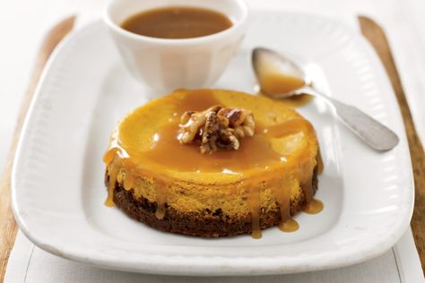 Pumpkin Cheesecake with Walnut-Ginger Crust and Caramel Sauce Recipe -- Yankee Magazine Walnut Cheesecake, Caramel Sauce Recipe, Walnut Crust, Caramel Recipes Sauce, Pumpkin Spice Syrup, Thanksgiving Food Desserts, Ginger Snap Cookies, New England Travel, Pumpkin Pie Filling