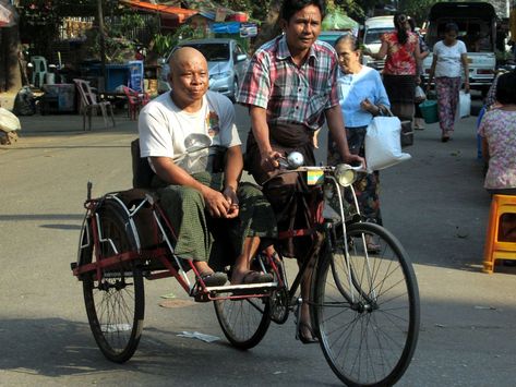 Though banned in the city center, cycle rickshaws are still a means of transportation on the back streets of Yangon, Myanmar (Burma). Yangon City, Myanmar Yangon City, Cycle Rickshaw, Bathroom Luxury Design, Luxury Design Print, Singapore Public Transport, Apartment Luxury, Printed Dress Shirts, Paris Hotels