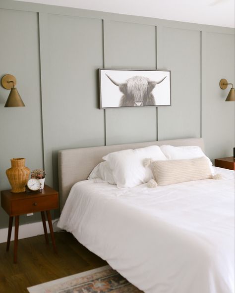 Green board and batten wall with a gray headboard against it and a highland cow picture Guest Bedroom Ideas Board And Batten, Waynes Coating Accent Wall Bedroom, Bedroom Wanes Coating, Easy Batten And Board, Guest Room Board And Batten, Mdf Bedroom Design, Board Batten Bedroom Wall, Green Batten Board Walls, Board And Batten Wall Guest Bedroom