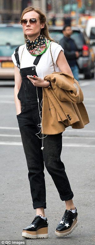 Comfy yet cool: Diane Kruger, 39, looks stylish in a pair of Big Star overalls as she hailed a cab in New York City last week. Spring Denim Outfits, Black Denim Dungarees, Diane Kruger Style, Black Denim Overalls, Style Overalls, Spring Denim, How To Wear A Scarf, Black Overalls, Diane Kruger