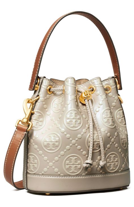 Contrast stitching accentuates the signature embossed leather and structured silhouette of this refined bucket bag accented with Tory Burch hardware. Lined Leather Imported Bucket Bags For Women, Tory Burch Bucket Bag, Luxury Diaper Bag, Classy Bags, T Monogram, Tory Burch Purse, Watches Collection, Golden Sunset, Everyday Purse