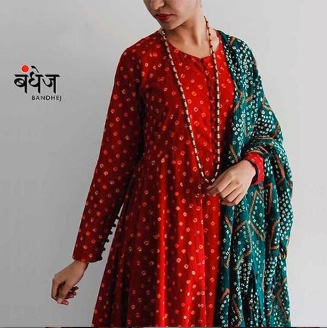 Bandhej suits and a variety of designer salwar kameez, flowing angarkhas with churidars, a range of contemporary tunic pants are available at BANDHEJ. The bandhani suits designs and fabrics are conceptualized in-house and are hand-woven by our skilled artisans. All these bandhej suits are available online. #BandhejSuits #BandhaniSuits #BandhejSuitsOnline Black Bandhani Kurti Designs, Bandhani Salwar Suit Designs, Bandhani Kurta Designs Women, Bandhani Dress Salwar Kameez, Bandhej Kurti Designs, Bandhni Suits Design, Bandhani Suits Design, Bandhani Kurti Designs, Bandhni Suits