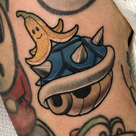 Cool little Nintendo shell tattoo from Super Mario Bros Blue Shell Tattoo Mario, Traditional Mario Tattoo, Super Mario Bros Tattoos, Mario Kart Tattoo, Mario Mushroom Tattoo, Nintendo Tattoo Ideas, Mario Tattoo Ideas, Nintendo Tattoos, Mario Tattoos