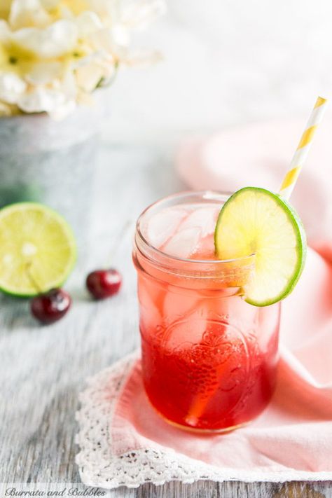 I love a good Sonic cherry limeade, but I love it even better with bourbon. This bourbon cherry limeade is a fun twist on a classic.  #BurrataAndBubbles #SonicCherryLimeadeRecipe #CherryBourbon #CherryBourbonCocktail  #BourbonCocktails #CocktailRecipes  #CherryCocktailRecipes #CherryLimeadeRecipe #CherryLimeadeRecipeAlcohol Cherry Cocktail Recipes, Cherry Limeade Recipe, Sonic Cherry Limeade, Bubble Recipe, Bourbon Cherries, Easy Summer Cocktails, Light Appetizers, Cherry Limeade, Best Cocktail Recipes