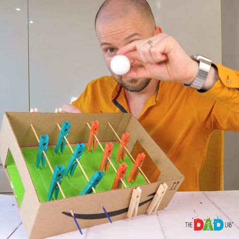 How to Make a Cardboard Football Game for Children | We are turning an empty cardboard box into a football table!⠀ ⠀ ⭕ Materials:⠀ - a small cardboard box⠀ - tape⠀ - a piece of green paper⠀ - white pencil⠀... | By TheDadLab Paper Football Game, Cardboard Box Games, Small Cardboard Box Crafts, Toys From Trash, Carnival Games For Kids, Football Table, Cardboard Box Crafts, Box Tape, Game For Children