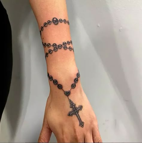 41 Divine Rosary Tattoo Designs: Channeling Spiritual Elegance in Ink - Psycho Tats Black And Grey Rosary Tattoo, Chain Around Wrist Tattoo, Rosery Tattoos On Arm, Rosary Bead Tattoo For Men, Rosery Tattoos For Women On Arm, Rosery Tattoos On Hand Women, Forearm Rosary Tattoos For Women, Rosary Tattoo With Names, Rosary Around Wrist Tattoo