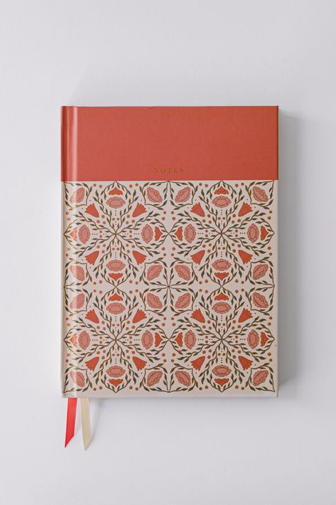 Meet the Folk Pattern Hardcover Notebook - Claret Rose, where practicality meets playful design. This 6.25" x 8.25" notebook features a hand-illustrated folk-style pattern on both the front and back covers, complete with eye-catching gold foil details that add a fun, vibrant touch. With lay-flat binding, it’s easy to write anywhere on its 200 gold-edged lined pages without fussing with stiff covers. Perfect for everything from journaling to everyday note-taking, this notebook is as functional as it is stylish. Its folk-inspired design gives it a unique, creative vibe that will make you excited to reach for it every day. With the Folk Pattern Hardcover Notebook, you'll enjoy both style and convenience in one delightful package. Product Details: Notebook measures 6.25" x 8.25" 200 Gold-edged Hardcover Book Binding, Folk Pattern, Notebook Cover Design, Notebook Printing, Folk Style, Ribbon Bookmarks, Hardcover Notebook, Hand Illustration, Stationery Notebook