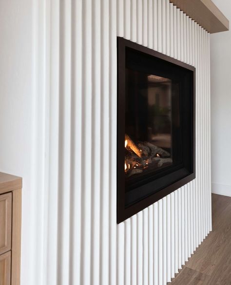 COZY CORNERS. In our Scottsdale interior design project, #HiddenHillsWithLolo, this eye-catching fluted fireplace makes the home… | Instagram Fireplaces Modern Farmhouse, White Fluted Fireplace, Flute Fireplace, Fluted Wood Fireplace Wall, Diy Fluted Fireplace, Fluted Stone Fireplace, Fluted Marble Fireplace, Fluted Tile Fireplace, Fluted Fireplace Surround