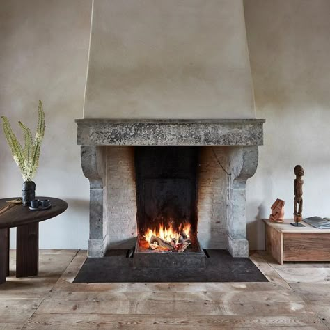 Joris Van Apers Studio on Instagram: "Warming up by this 17th century French fireplace. Reclaimed French cheese boards, pine table and walnut case. Joris Van Apers, design and realization. @jorisvanapersstudio @verlindejanphotography #jorisvanapersstudio #jorisvanapers #interiordesign #interiorarchitecture #architectureinteriors #contemporaryhome #interiorinspo #livingroomdesign #livingroom #fireplace #softminimalism #warmminimalism #belgiandesign #simplicity #craftsmanship #woodenflooring Venetian Fireplace, French Fireplace Ideas, French Farmhouse Fireplace, Colonial Fireplace, Reclaimed Fireplace, Cottage Fireplace, Rural Property, Indoor Fireplaces, Dublin House