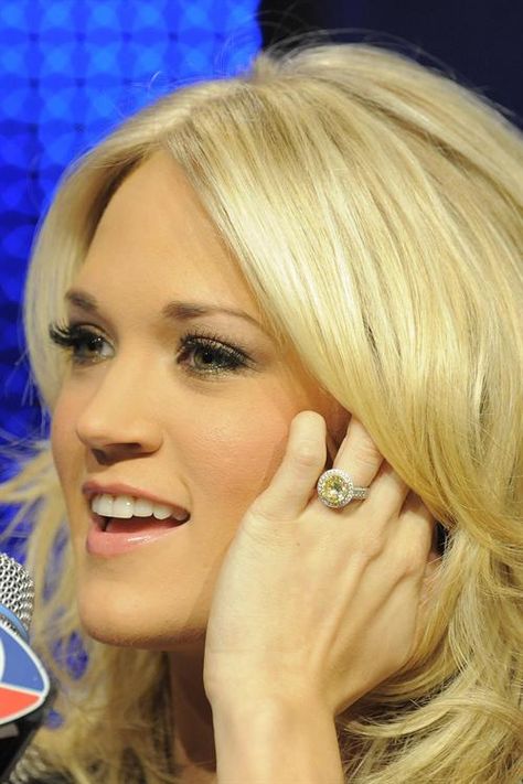 Carrie Underwood's round pale yellow diamond. Yup. Her husband did a good job. Carrie Underwood Ring, Carrie Underwood Wedding Ring, Carrie Underwood Engagement Ring, Carrie Underwood Wedding, Canary Diamond Engagement Ring, Celebrity Wedding Rings, Yellow Diamond Jewelry, Celebrity Rings, Pale Makeup