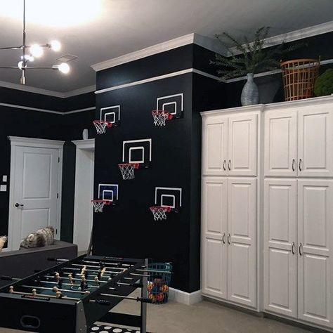 Black Wall Paint With Basketball Hoops Mens Game Room Ideas Game Room Ideas For Men, Room Ideas For Men, Game Room Ideas, Black Painted Walls, Ball Ideas, Basketball Hoops, Entertainment Console, Man Room, Entertainment Design