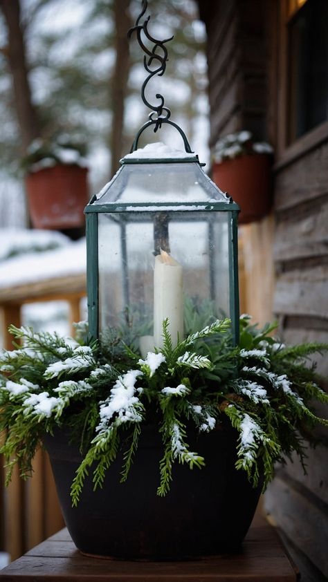 Transform your front porch into a winter wonderland with stunning winter planters This blog post offers creative ideas to elevate your outdoor space featuring DIY projects that are both simple and elegant Discover how to incorporate vibrant pansies and tall branches for a breathtaking display perfect for the colder months Explore easy ways to use fake plants for a low-maintenance solution and learn to create a cozy atmosphere with beautiful lanterns and farmhouse-inspired dec Outdoor Winter Planters, Christmas Planters Outside Front Porches, Outdoor Lantern Ideas, Winter Urns, Beautiful Lanterns, Winter Planters, Winter Planter, Christmas Displays, Lantern Ideas