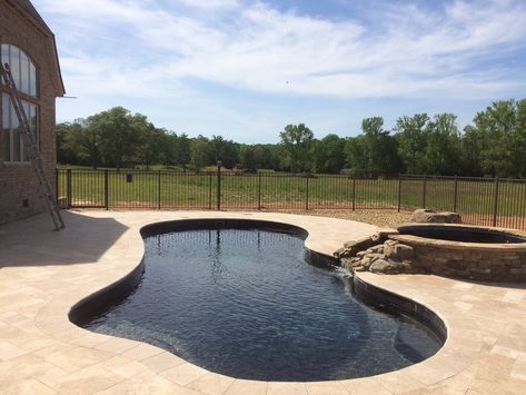 Live life at its best through the enjoyment of the Imagine Pools "Fantasy 35" fiberglass swimming pool in Volcanic Black, like this one installed by the professional team at B and B Pools, Pelzer, SC.  This color is becoming much more popular and it's easy to see why as this color reflects a lot of light creating beautiful reflections and a very calming environment.   Learn more by contacting B and B Pools at (864) 243-9349 or visit our website at www.ImaginePools.com. Tuscany Pool, Imagine Pools, Calming Environment, Fiberglass Swimming Pools, B And B, Fiberglass Pools, Design Consultation, Pool Ideas, Garden Bridge