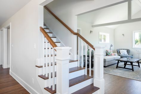 Stairway in First Floor Open-Concept & Remodel | Designed by Kirsten Dumo, Built by Model Remodel, Seattle, WA © Cindy Apple Photography Open Concept With Stairs In Middle Floor Plans, Open Concept Stairs In Middle, Staircase Open On Both Sides, Center Staircase Open Floor Plan, Open Concept Staircase, Closed In Staircase Ideas, Open Concept With Stairs In Middle, Open Stairs In Living Room, Open Staircase Ideas