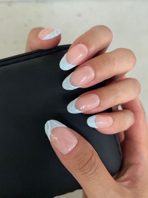 Special Offer: Enjoy free shipping on orders of $55 or more with the code: FREESHIP55. This collection features a variety of nail styles to suit your personal taste, including  Coffin and Oval. The model is showcasing our Oval-shaped nails, adorned with delicate blue patterns that evoke the calming essence of the ocean breeze. Each pair of nails in this collection is meticulously crafted by skilled manicurists, ensuring that every set is unique. As these designs are handmade, they may feature slight imperfections, adding a touch of individuality and character to your look. Cute Oval Nails Ideas, Pale Blue Nails French Tip, French Tips Teal, Oval Nail, Nail Art French Tip Designs, Simple Nails Coffin, Nail Art Designs French Tip, Calm Nails, Nails Oval Shape