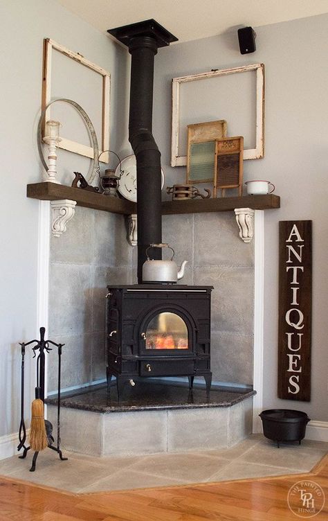 Excuse us while we pick our jaws up! Her fireplace idea is gorgeous Fireplace Mantel Makeover, Corner Fireplace Mantels, Wood Burning Stove Corner, Corner Fireplace Makeover, Corner Wood Stove, Wood Stove Surround, Corner Stove, Stove Decor, Comfy Living Room Decor