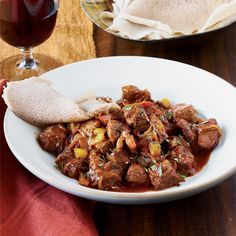 Made with tender lamb, this staple of Ethiopian home cooking is flavored with awaze sauce, a kicky blend of berbere spices, smoked paprika, mustard and red wine. Tibs Ethiopian, Lamb Stew Recipes, Ethiopian Cuisine, Spiced Lamb, Ethiopian Food, Lamb Dishes, Lamb Stew, Food Experience, Hearty Stews