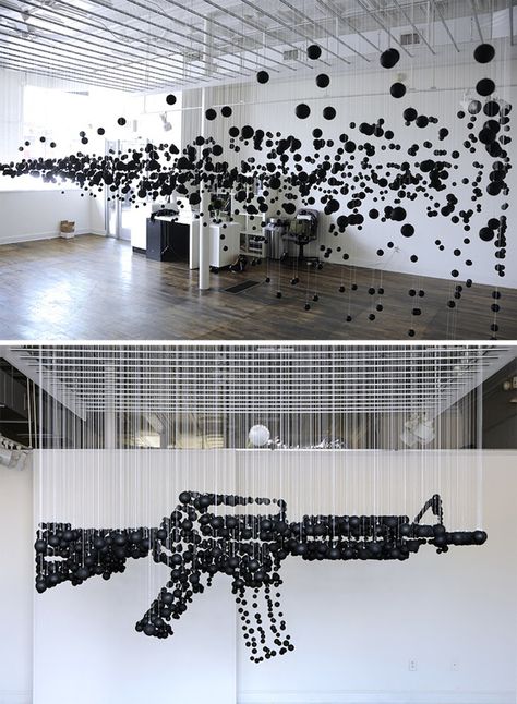 Michael Murphy- Called Damage, the sculptural work consists of a sea of 1,200 ping pong balls, painted black, and then suspended from a ceiling. Opened just last Friday at the Association for Visual Arts, in Chattanooga, Tennessee, Damage is meant as a way for us to really start talking about the controversial role guns play in today's society. فن الرسم بالمسامير, Suspended Art, Michael Murphy, 3d Street Art, Perspective Art, Illusion Art, A Level Art, Sculpture Installation, Ping Pong