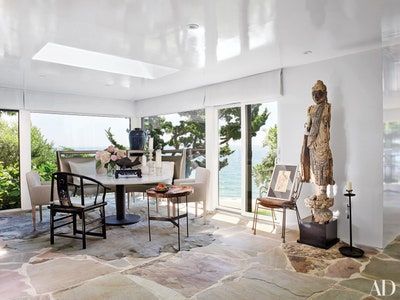 Vincent Wolf Interiors, Vicente Wolf, Goth Interior, Copper Side Table, Montauk New York, Island Beach House, Enclosed Patio, Eclectic House, Cowhide Rugs