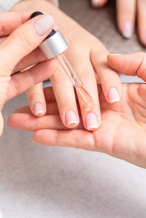 Nail experts explain what does cuticle oil do, the benefits of cuticle oil, how to use cuticle oil, and some of the best cuticle oils to try. #beautyhacks #beautytips #nails #cuticleoil Cuticle Oil Benefits, Best Cuticle Oil, Empty Nail Polish Bottles, Healthy Cuticles, Cute Pink Nails, Nail Oil, Nail Polish Bottles, Brittle Nails, Shiny Nails