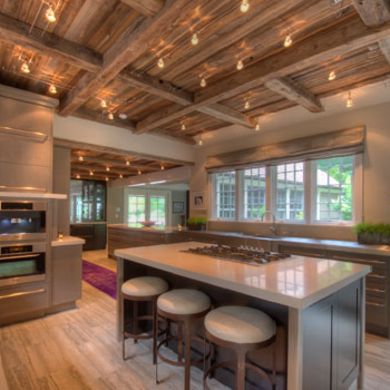 #LGLimitlessDesign & #Contest The several  things I really like - the exposed kitchen beams, the lighting on the ceiling and counter stools that combine edginess of metal and comfort of upholstered seat.  Really good to look at but also looks functional and comfortable.  Found on bobvilla.com Track Lighting Exposed Beams, Exposed Joists, Kitchen Beams, Ceiling Inspiration, Kitchen Island With Stove, Exposed Ceiling, Exposed Beams Ceiling, Track Lighting Kitchen, Popular Kitchen Designs