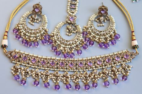 LAVENDER  PURPLE CHOKER  Very Gorgeous and elegant Lavender Polki stone choker with matching earrings and tikka Perfect to wear at weddings occasions.  Highest quality and craftsmanship  Ready to ship from Maryland, United States  Free US standard shipping  Order now and receive it within 3-4 business days. Please let me know if you have any questions Purple Choker Necklace, Polki Choker Set, Punjabi Jewelry, Purple Choker, Polki Choker, Indian Choker, Indian Choker Necklace, Beaded Art, Ear Chain