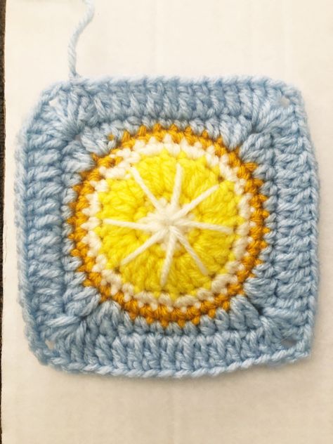 Lemon Granny Square ABBREVIATIONS MG - Magic Ring CH - Chain SC - Single Crochet HDC - Half Double Crochet DC - Double Crochet SS - slip stitch SUPPLIES NEEDED: •4 Colors of yarn(medium/4) -Color 1- White(preferably w/sparkle) -Color 2- Light Yellow -Color 3- Bright Yellow -Color 4- Blues •Size G crochet hook •Scissors •Crochet needle for hiding ends • start with a MG • Row 1(using color 1) - 12 SC I to MG, close ring with a SS through the first SC dropping color 1 an Lemon Granny Square Crochet Pattern, Lemon Granny Square Crochet, Lemon Granny Square, Crochet Granny Square Throw, Crochet Hdc, Crochet Needle, Embroidery Bags, Crochet Needles, Fun Crochet Projects