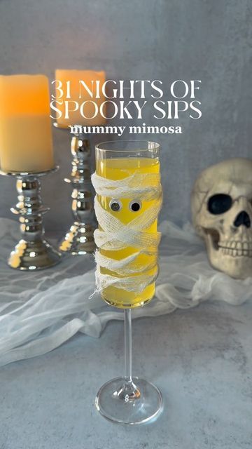 that’s the spirits on Instagram: "night 14: mummy mimosa wrap flute w/ cloth + eyeballs 1/2 oz orange juice top w/ champagne enjoy! #thatsthespirits #31nightsofspookysips #spookysips #halloweencocktail #halloween #halloweendrink #drinkstagram #drink #cocktail #mummymimosa #champagne #mimosa #mummy #fyp" Halloween Themed Mimosa, Vampire Mimosa, Halloween Mimosas, Halloween Champagne Cocktails, Halloween Mimosa Bar, Ghost Themed Drinks, Ghost Drink, Mummy Cocktail, Orange Halloween Drink