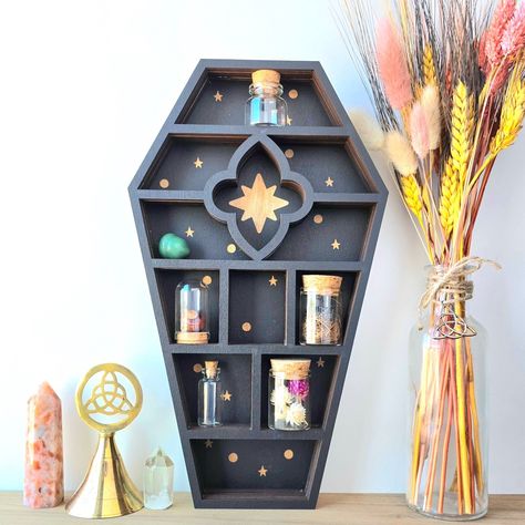 A sneak peek of one of the new curios shelves that are releasing this coming Monday! I mean, you can't have too many coffin shelves. I recreated a classic and added my own pizzazz. What do you think? . The Witch’s Curios Collection is releasing this Monday, 09/09/24! This collection features 12 unique Curios Shelves, 4 Curios Kits, and more magickal items. Don’t miss out on these treasures! 🌙 . . . . #lunarlightapothecary #witchshop #witchythings #curios #curiosity #curiosities #coffin #coff... Display Shelves For Collectables, Small Display Shelf, Crystal Shelf Display, Gothic Shelf, Coffin Shelves, Wood Coffin, Coffin Shelf, Diy Gothic, Crystal Storage