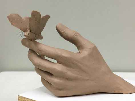 Butterfly hand maquette Hand Sculpture Poses, Hand Sculpture Reference, Hand Statue Sculpture, Clay Art Butterfly, Clay Hand Sculpture Tutorials, Clay Statues Sculpture, Clay Hands Sculpture, Ceramic Hand Sculpture, Hand Sculpture Clay