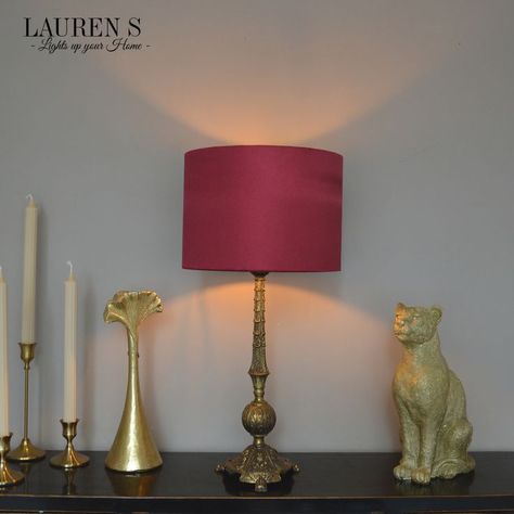 For a glamorous touch to your winter decor, try rich wine-red tones and gold accents inspired by Gatsby-era opulence. Create a perfect atmosphere with lighting that reflects the elegance of the 1920s. Chic Interior, Red Interiors, Red Satin, Lamp Shades, Wine Red, Winter Decor, Gatsby, Gold Accents, Pendant Lamp