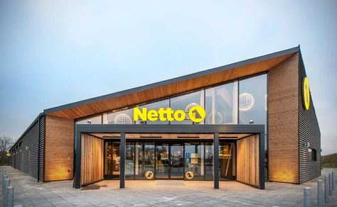 New timber-framed and sustainability-certified convenience store concept for Danish retailer Netto and Salling Group, by C.F. Møller Architects Convenience Store Exterior Design, Facade Store Design, Convenient Store Design, Market Building Design, Cafe Facade Design, Plywood Showroom, Convenience Store Design, Sensory Playground, Commercial Elevation