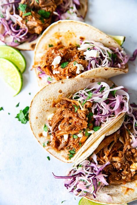 These tacos are filled with mouthwatering slow cooker pulled pork and creamy cilantro lime slaw. Easy, effortless and delicious! Pulled Pork Recipes Healthy, Pulled Pork Tacos Sauce, Taco Pulled Pork, Pork Taco Slaw, Slow Cooker Pulled Chicken Tacos, Pulled Pork Healthy Recipes, Sauce For Pulled Pork Tacos, Sauce For Pork Tacos, Pulled Pork Burgers